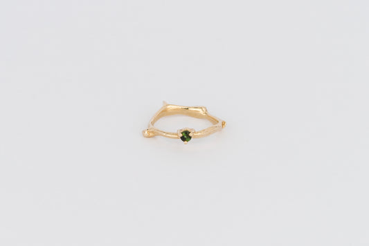 delicate branch style gold ring set with green tourmaline